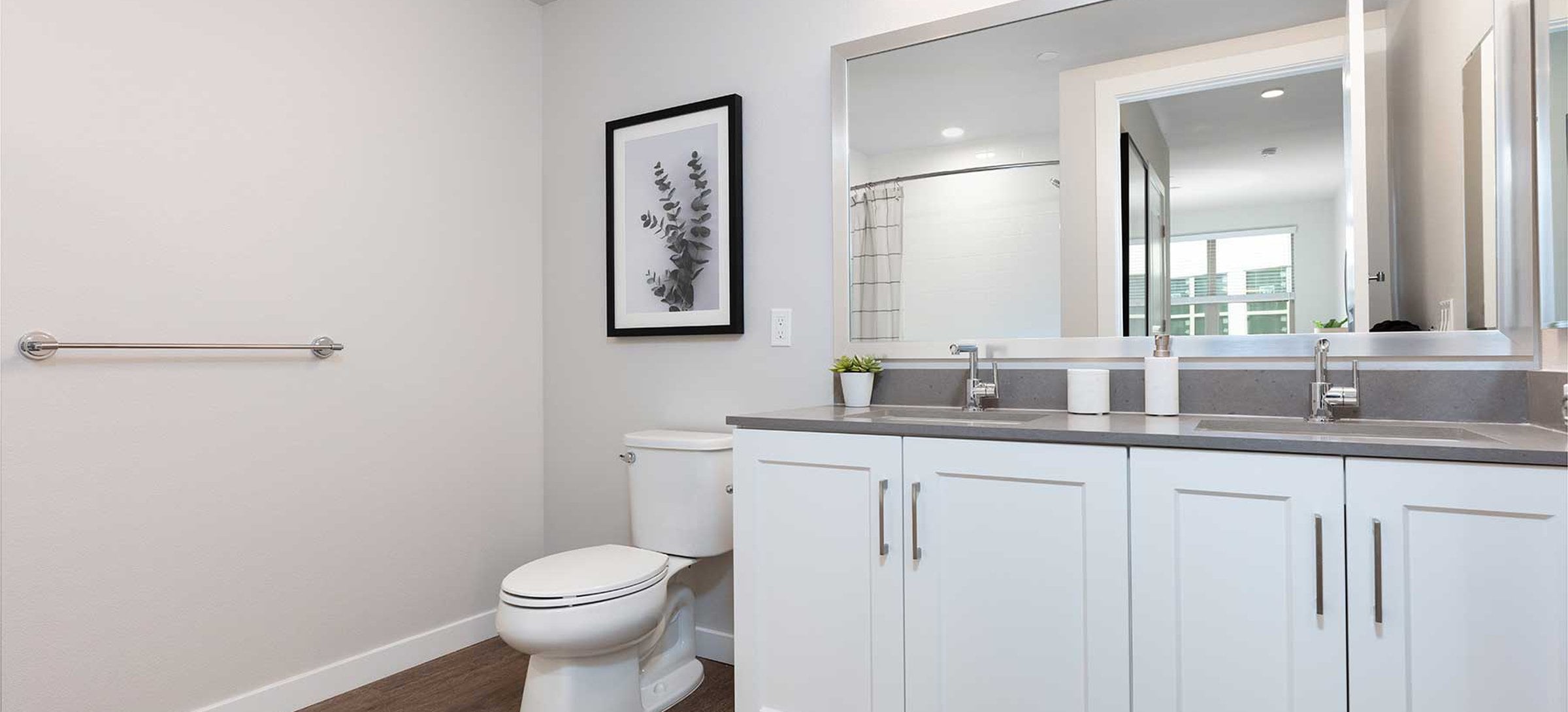 Upgrade Collection bath with white cabinetry, grey quartz countertop, and hard surface flooring