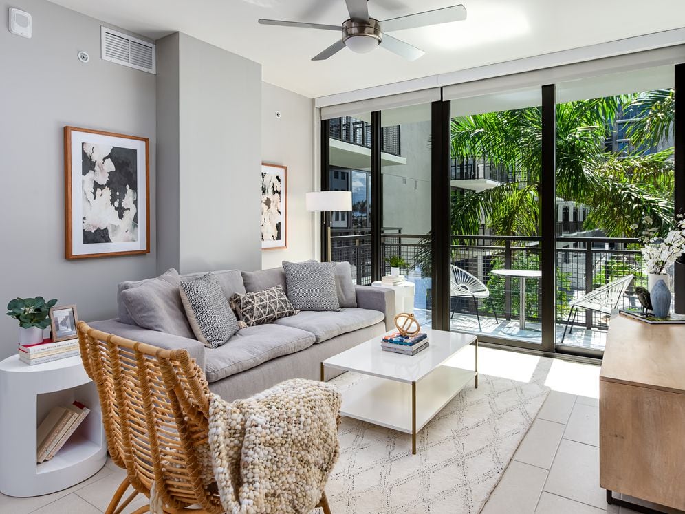 Living area and balcony overlooking pool