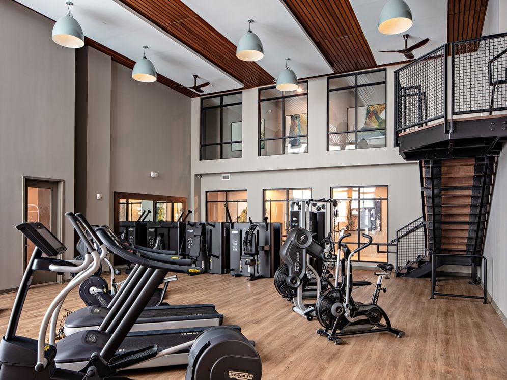 Two-level fitness center with cardio and strength equipment