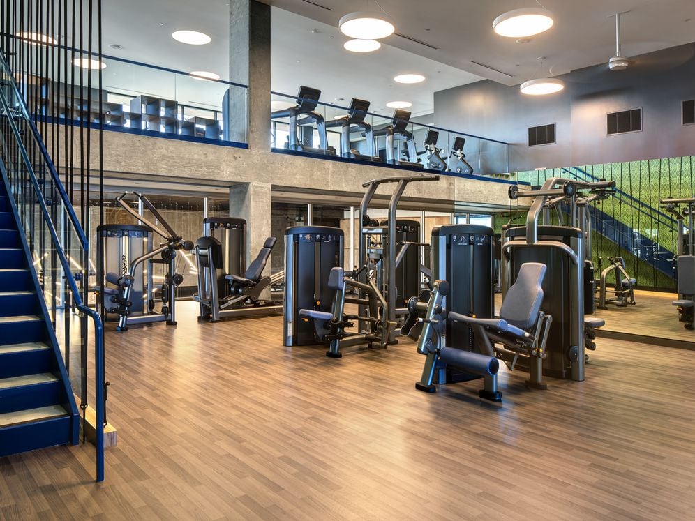 Two-level fitness center with cardio and strength equipment