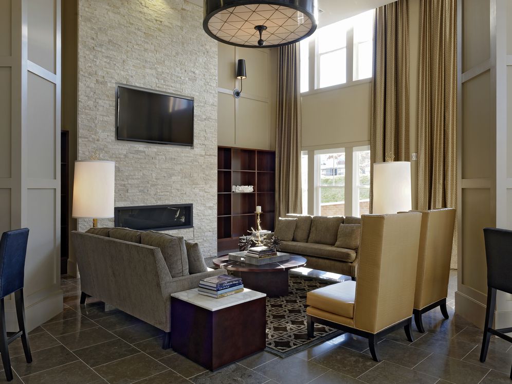 Lobby with lounge seating, fireplace and flat screen television
