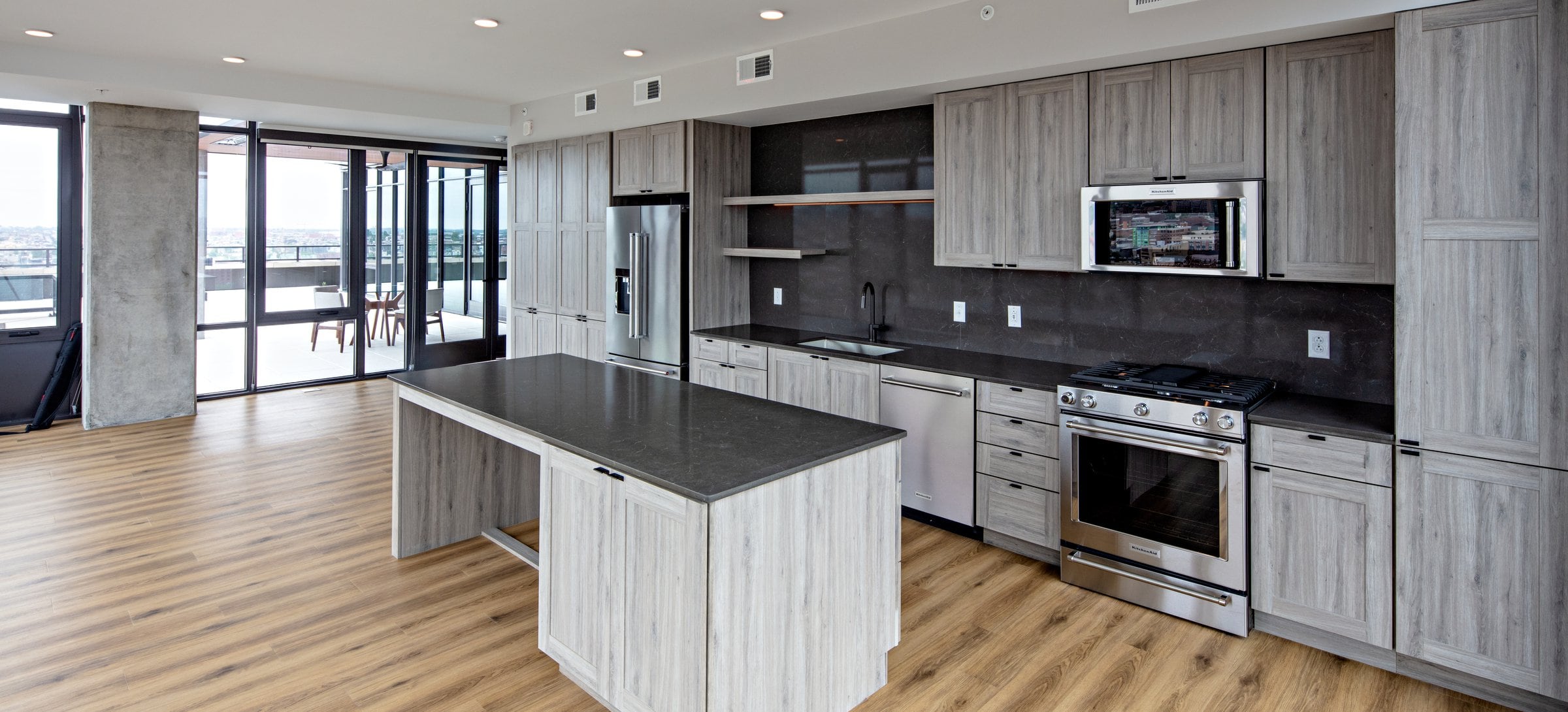 Penthouse-level Signature Collection apartment homes feature kitchens with upgraded finishes and appliances