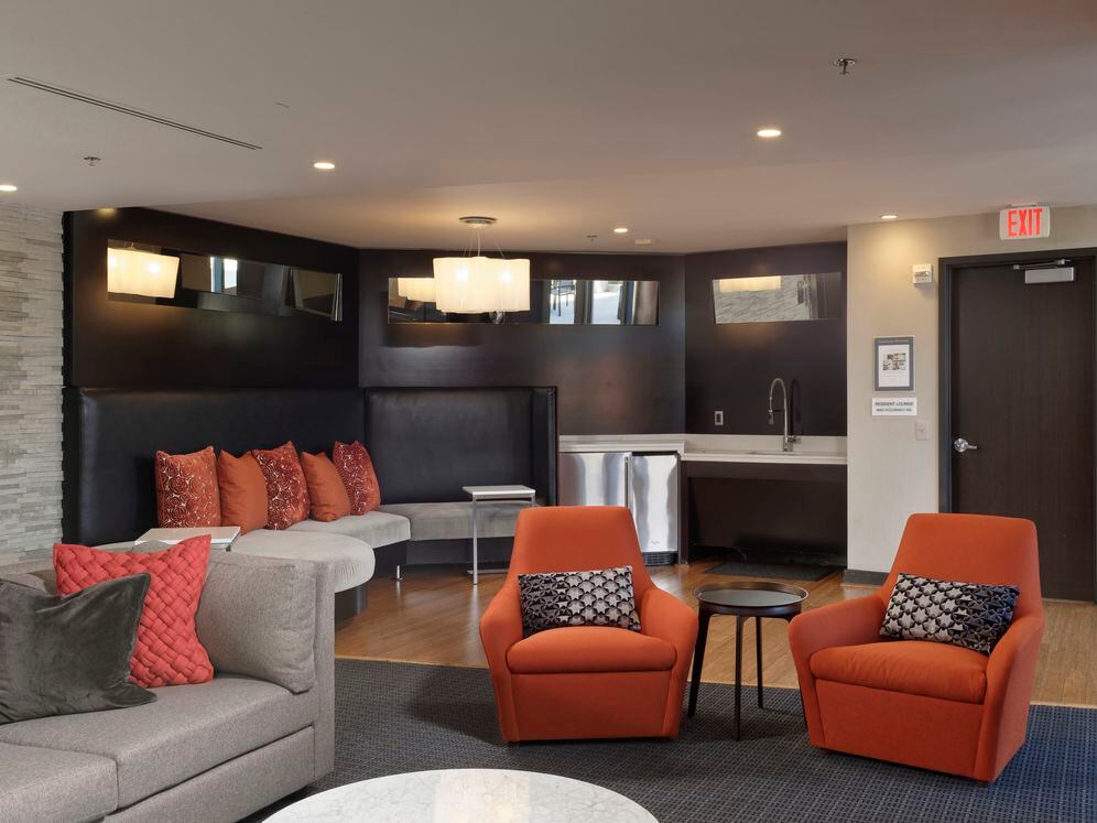 Resident lounge with seating and entertaining kitchen