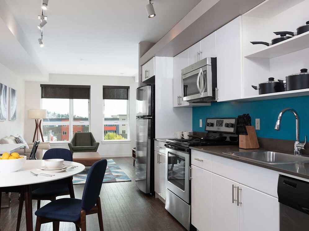 Furnished+ apartment homes include a dining set (Representative Image – exact items and style of furnishings may vary)