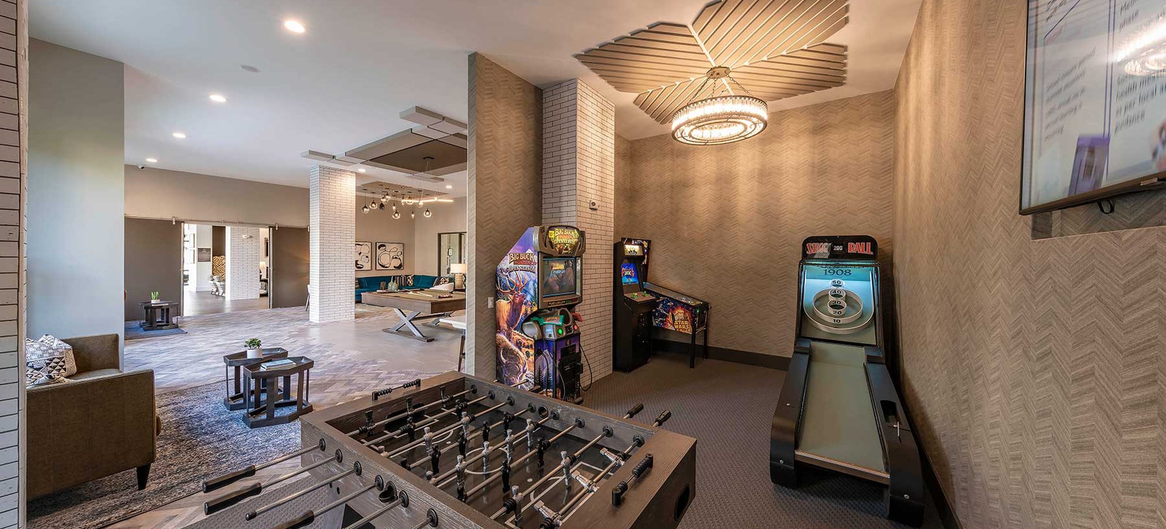 East building resident lounge with foosball table and arcade games