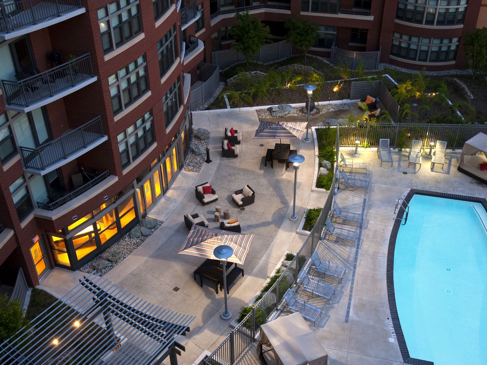 Courtyard with swimming pool, sundeck, cabanas and lounge seating