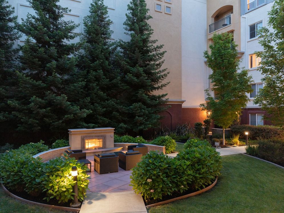 Courtyard with fireplace and lounge seating
