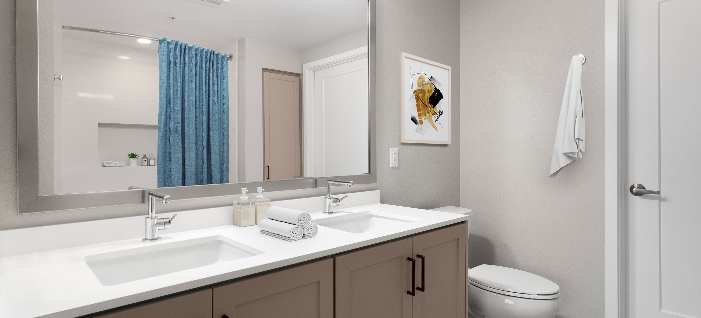 Townhome bath with white quartz countertops, brown cabinetry, and hard surface flooring (select homes)
