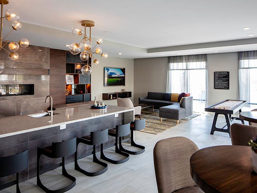 Lounge with TV, shuffleboard, and entertaining kitchen