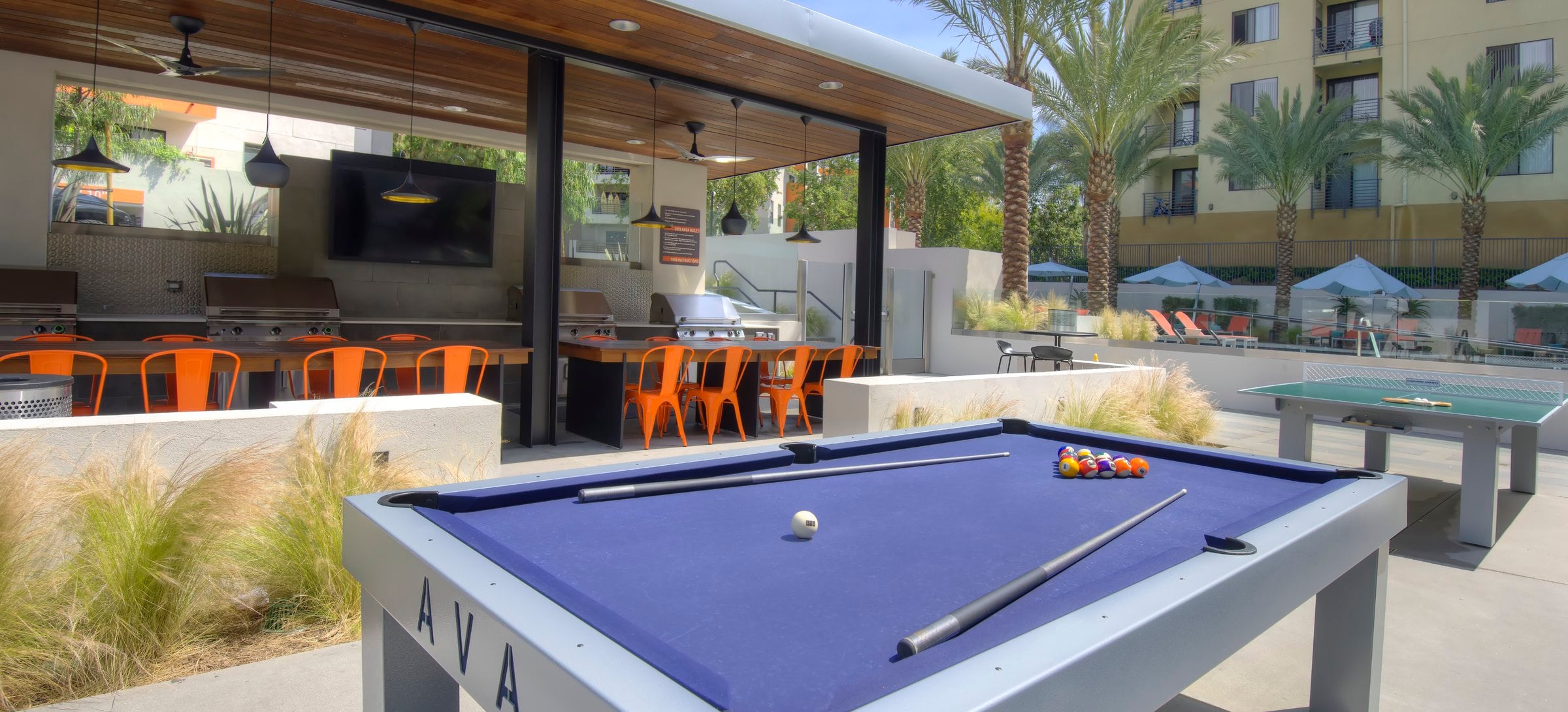 Outdoor Kitchen with Grills and Game Tables