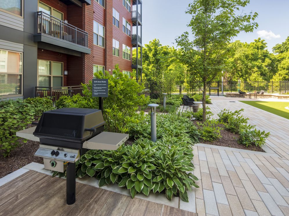 Courtyard with grill stations and dining tables