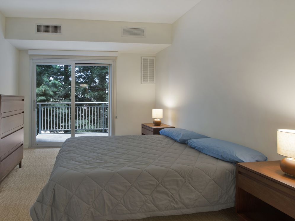Furnished+ apartment homes feature queen bed with mattress, dresser, nightstands, and lamps (Representative Image – exact items and style of furnishings may vary, comforter and pillows are not included)