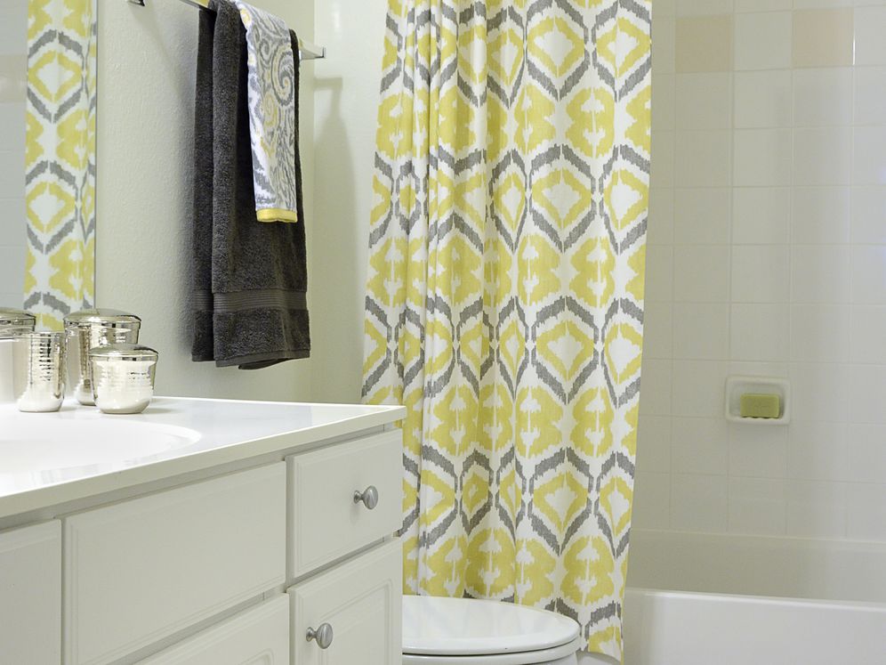 Classic I bathroom with white cabinetry, white countertop, and tile flooring