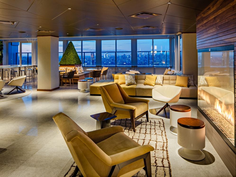 Rooftop lounge with common area seating and fireplace