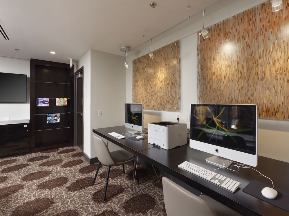Business center with computer workstations, printer and WiFi access