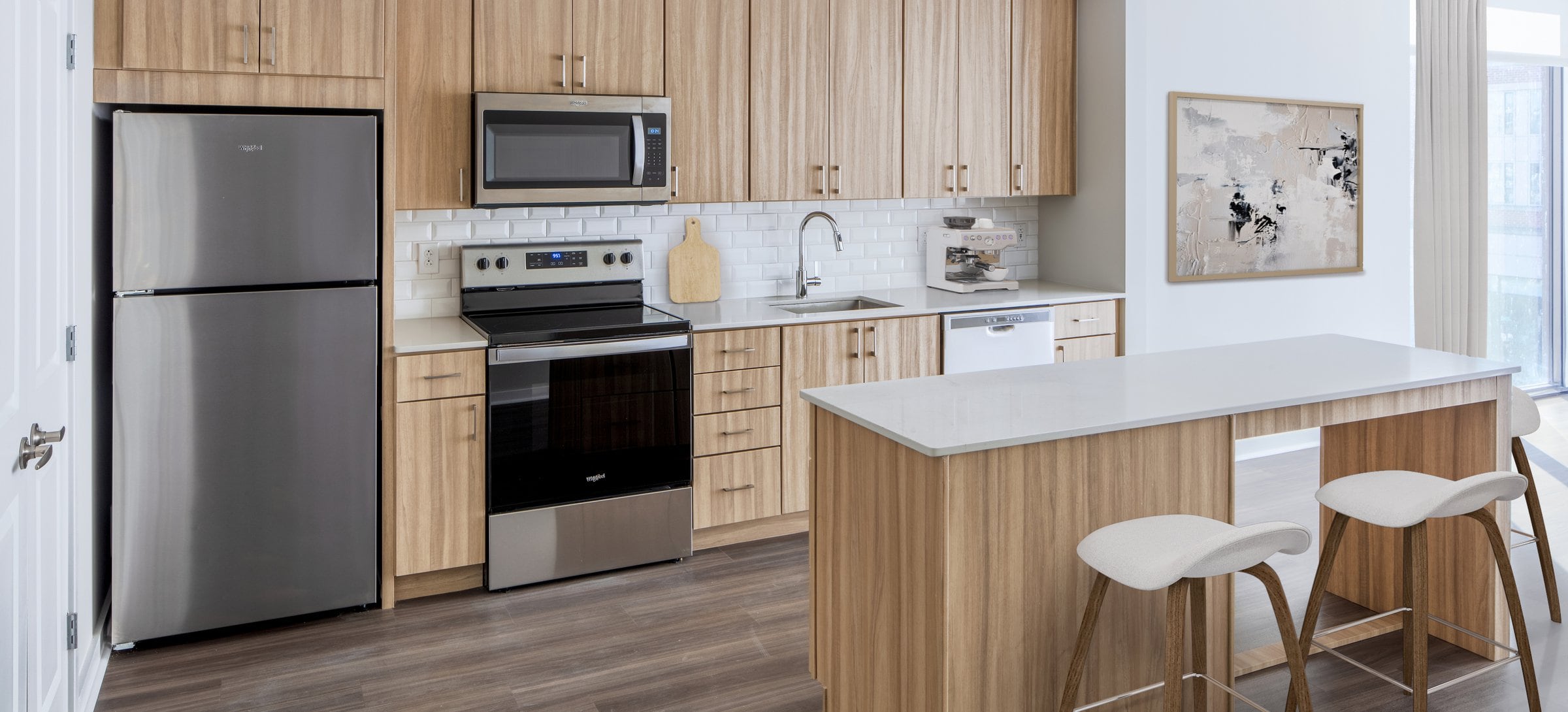 Brand new apartments with kitchens featuring oak cabinetry, white quartz countertops, and stainless steel appliances (Representative photo)