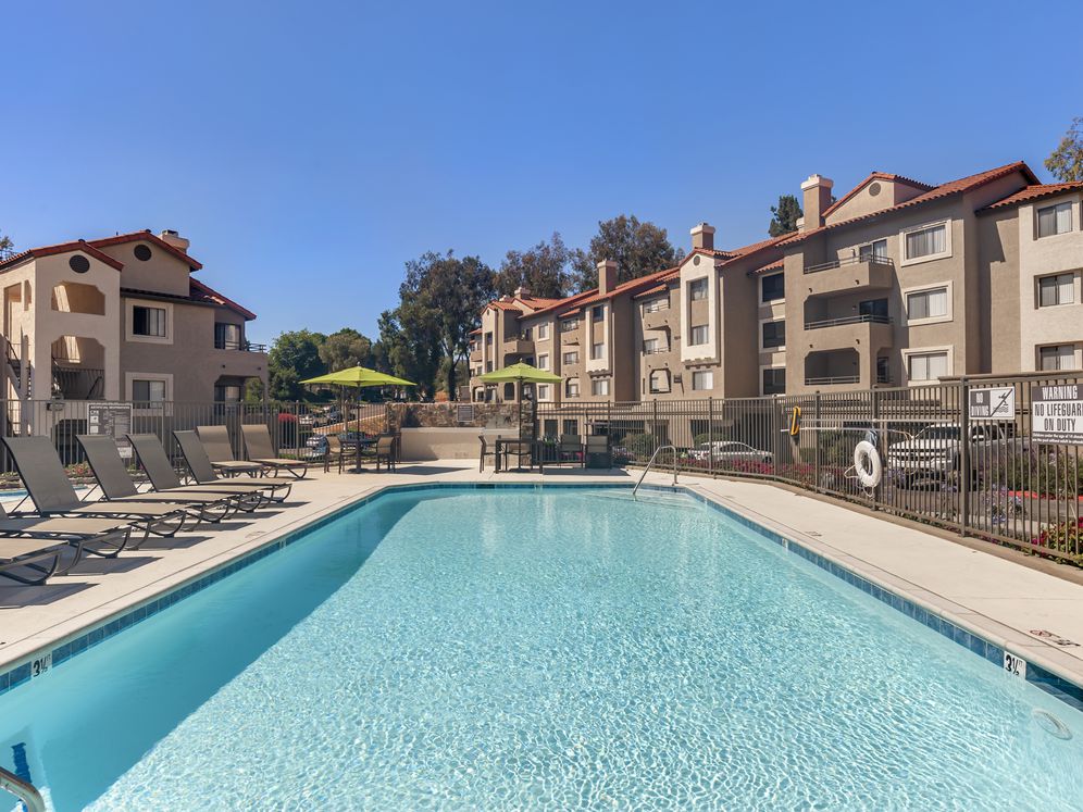 Swimming pool and sundeck with lounge seating