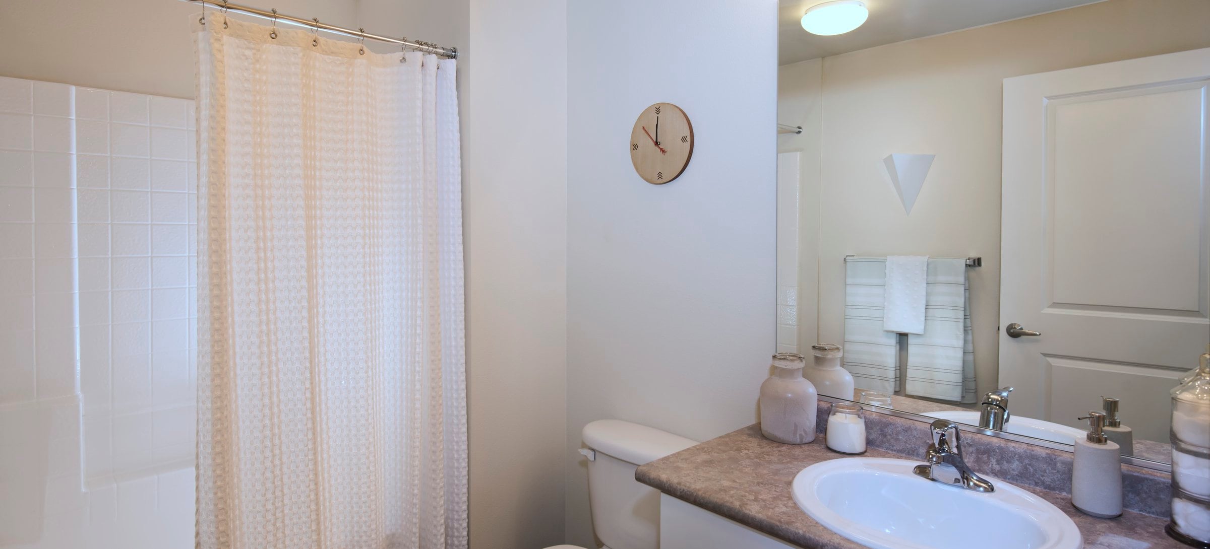 Classic Package I bath with white cabinetry, laminate countertops, and tile flooring